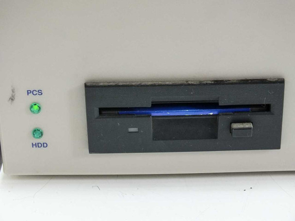 Talaris Systems 20-1100209 Printstation — close-up of front panel showing 3.5-inch floppy drive bay with blue bezel, PCS green LED indicator, and HDD green LED indicator