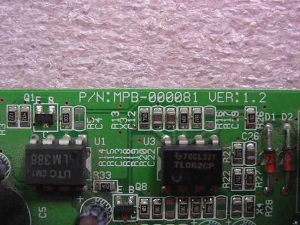 ESS MPB-000081 modem card – close-up of PCB showing P/N MPB-000081 VER:1.2 silkscreen, LM386 op-amp, and TL062CP op-amp