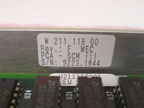 Staubli Unimation W.211.118.00 label close-up showing part number W 211 118 00, Rev F, WEC, PCA SCM IIi, and serial number 9223.1644