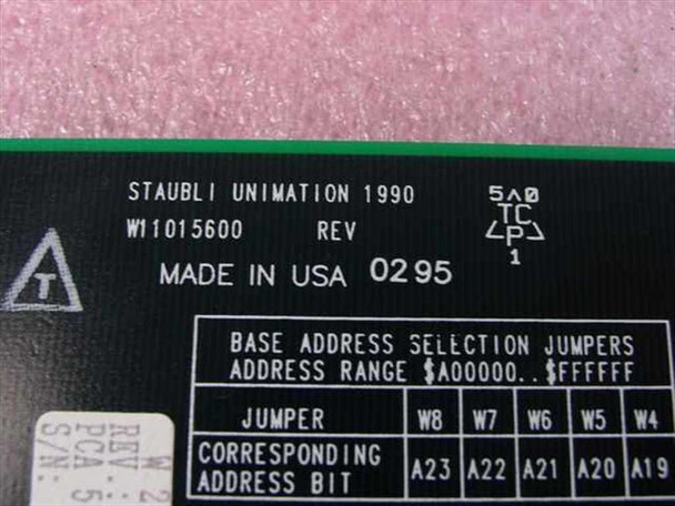 Staubli Unimation W.211.149.00 label detail showing part number W11015600, REV, Made in USA 1990 date code 0295, and base address selection jumper table