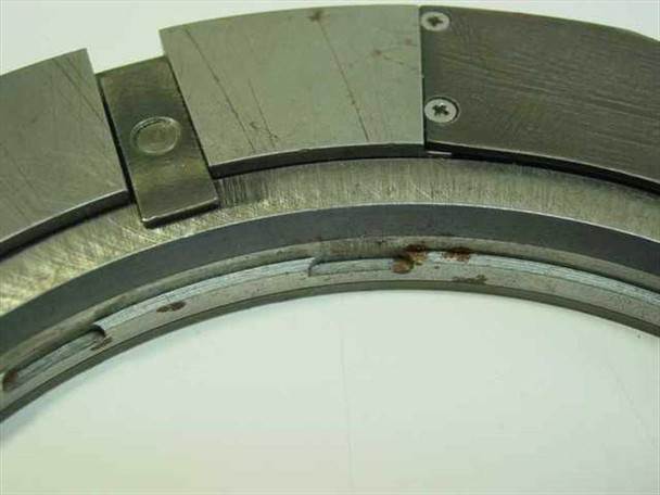 Side edge close-up of ring stage inner race showing surface rust and wear on the rotating interface