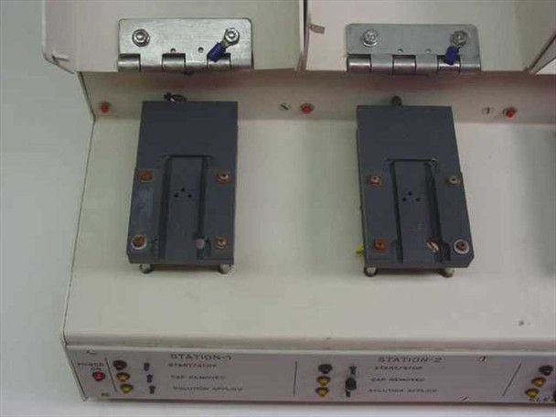 Elite Engineering Electrode Test Station — top view of Stations 1 and 2 with lids open revealing electrode fixture holders and hinge hardware