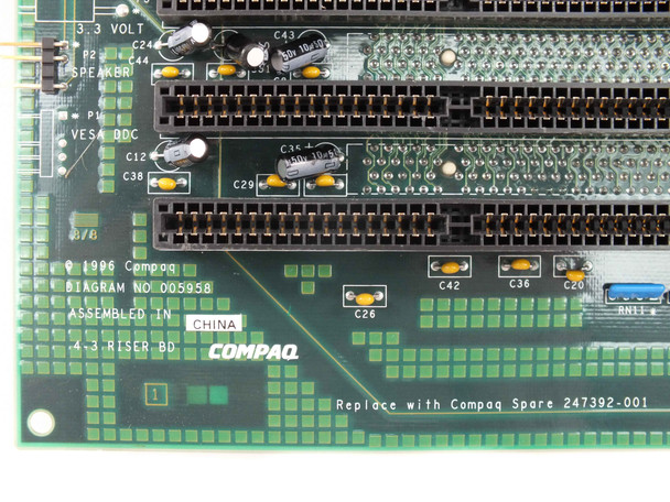Compaq 247392-001 riser board — close-up of component area showing DIAGRAM NO 005958, 4-3 RISER BD silkscreen, Compaq logo, and 'Replace with Compaq Spare 247392-001' text