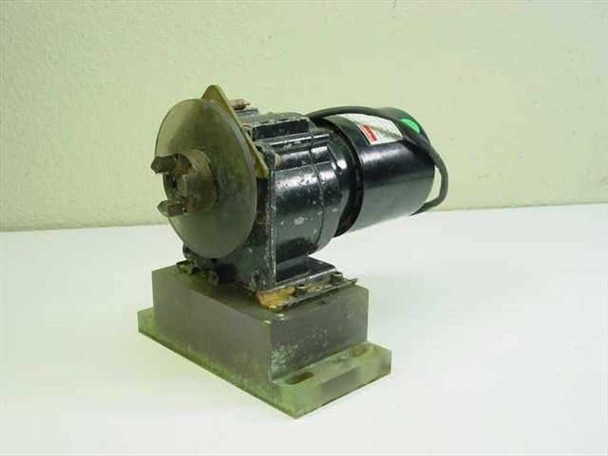Dayton 3M328A gear motor on base — side view showing output shaft end with corroded coupling flange and clear plastic guard