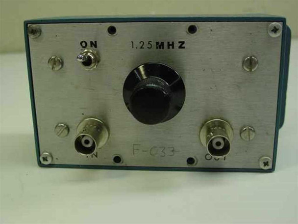 Pomona Electronics F-033 1.25 MHz Band Pass Filter — front panel view showing ON toggle switch, 1.25 MHZ label, tuning knob, and BNC IN/OUT connectors with F-033 designation