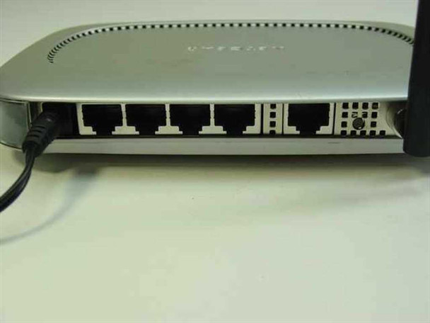 Netgear WGT624 – rear panel showing 4 LAN RJ-45 ports, 1 WAN port, reset button, and DC power jack