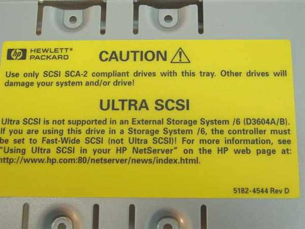 HP 5182-4544 Rev D label — Hewlett-Packard caution tag showing SCA-2 compliance requirement and NetServer D3604A/B compatibility note