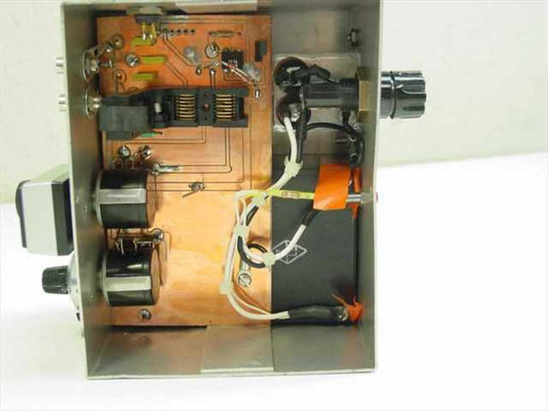 Interior top-down view of steel equalizer enclosure showing PCB with RF circuitry, inductors, and internal wiring