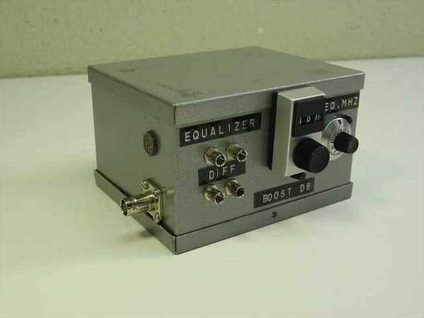Steel enclosure RF equalizer front-left angle view showing EQUALIZER label, DIFF BNC connectors, FREQ MHz dial, and BOOST DB knob