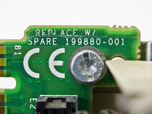 Compaq 199880-001 PCB close-up showing 'Replace w/ Spare 199880-001' silkscreen label and CE mark