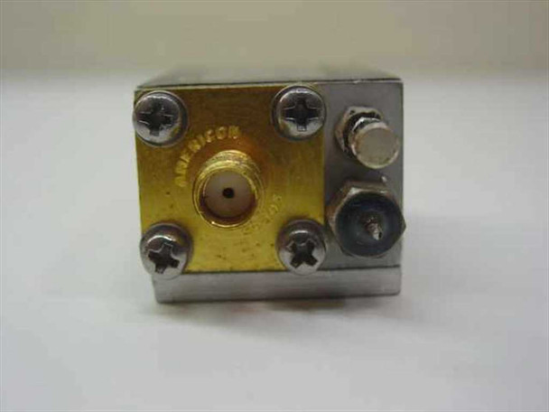 Avantek UTA-9665 RF amplifier – end view showing SMA female input connector on gold-toned face plate (Americom marking visible)
