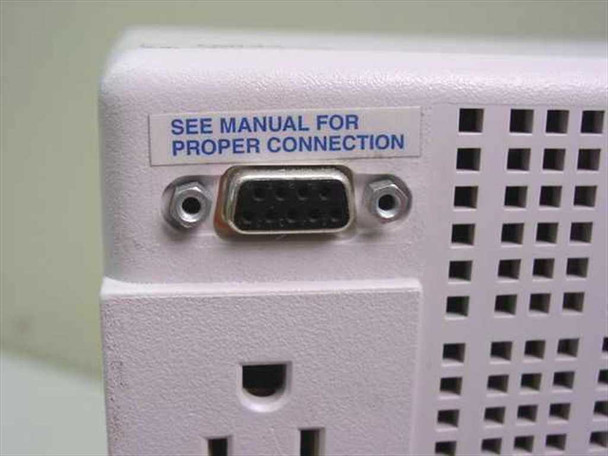 Tripp Lite SMART700 rear panel DB9 serial port close-up with 'See Manual For Proper Connection' label
