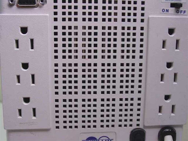 Tripp Lite SMART700 UPS rear outlet bank close-up showing six NEMA 5-15R AC receptacles and ventilation grille