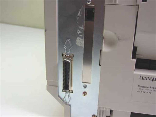 Lexmark Optra K 1220 rear panel showing Centronics parallel port connector with partial Lexmark label and machine type label