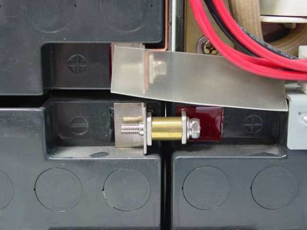 Minuteman PML2000 battery terminal connector close-up showing bolt-type battery post connection hardware