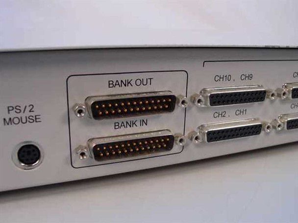 Raritan MCPS16 rear panel close-up showing Bank OUT and Bank IN DB25 cascade connectors and PS/2 mouse port