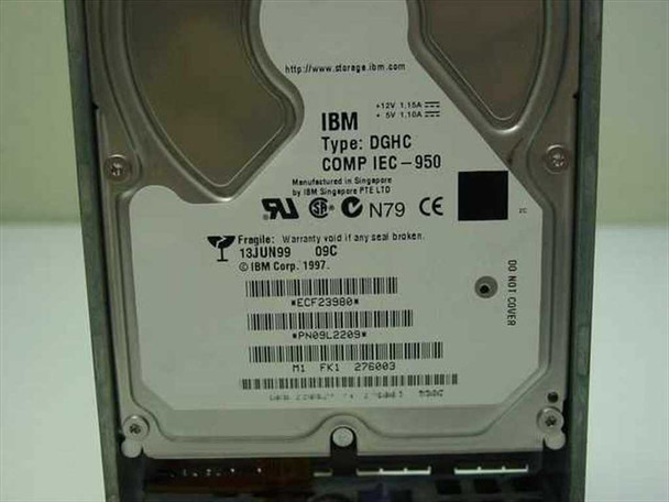 IBM 09L2209 hard drive label showing Type DGHC, COMP IEC-950, +12V 1.15A +5V 1.16A, ECF23980, PN 09L2209, manufactured in Singapore by IBM Singapore PTE LTD, dated 13JUN99
