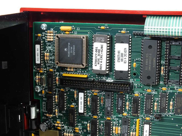 Close-up of Kronos 460F main board showing Motorola QFP processor chip, board number 6700377-001 Rev C2, and memory ICs