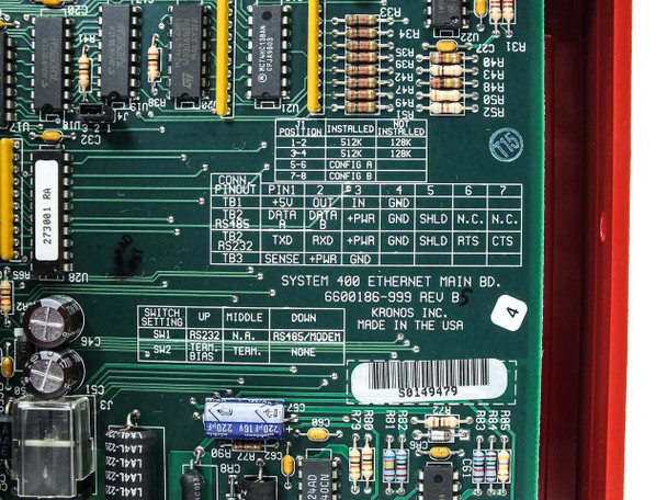 Close-up of Kronos System 400 Ethernet Main Board 6600018K999 Rev B with switch settings, connector pinout labels, and RS232/RS485/modem configuration printed on board