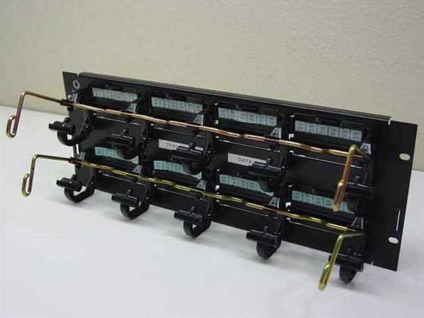 Lucent PatchMax 110 telephone cable rack patch panel – front-angle view showing four IDC block modules and gold cable management hooks