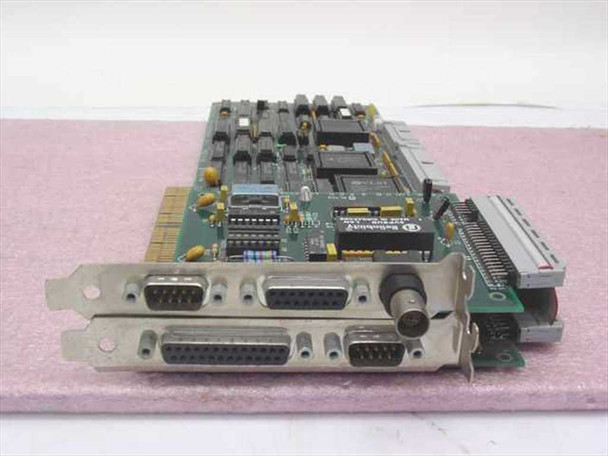Altos 615-24565-001 PCA DB circuit board with 615-24563-001 expansion card attached — angled top view showing DB9, DB25, and BNC connectors on bracket