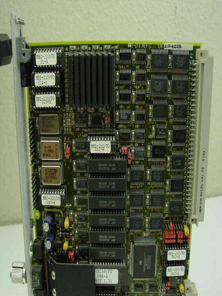 VIGRA MMI-210 PCB close-up — board label 'MMI-210 REV C', sub-assembly labels, Toshiba SRAM chips, oscillator, and REV 1.31 marking
