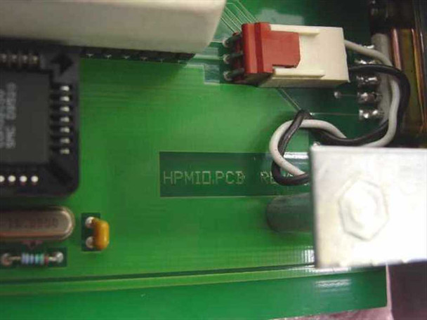 ESI HPMIO PCB close-up showing HPMIO PCB silkscreen marking, crystal, and red connector block