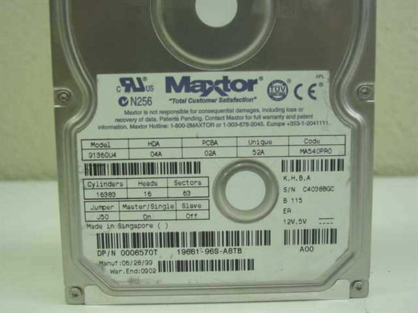 Maxtor 91360U4 hard drive bottom label — showing model, HDA, PCBA specs, cylinder/head/sector info, jumper settings, Dell P/N 0006570T, and manufacture date 06/28/99