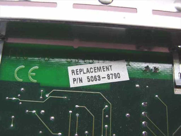 HP 5063-8790 replacement part number label on PCB – label reads REPLACEMENT P/N 5063-8790 with CE mark visible