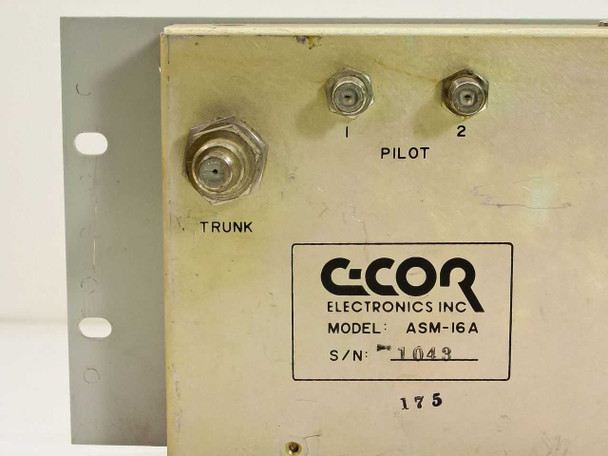 C-COR Electronics ASM-16A rear panel label with model, serial number, and Trunk plus Pilot 1 and 2 F-type ports
