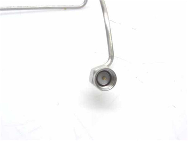 SMA-M male connector end close-up showing center pin on preformed stainless steel coaxial cable 202544-001