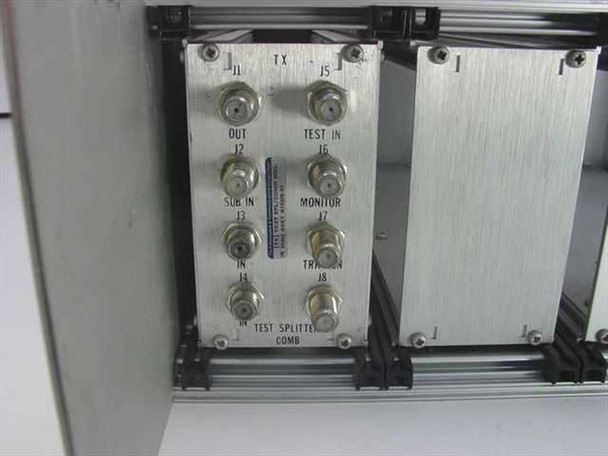 Ford Aerospace 57402 Test Splitter Comb Module — closeup of installed module face with 8 BNC connectors labeled J1 through J8: OUT, SUB IN, IN, TX, TEST IN, MONITOR, TRAN