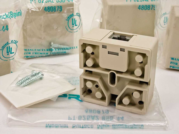 Rear and bottom view of Premier PT-625A2-8SB-44 surface mount wall jack showing mounting tabs, cable entry channels, and internal wiring guides