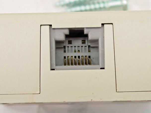 Close-up of RJ-45 8-pin modular port on Premier PT-625A2-8SB-44 surface mount wall jack showing gold-plated contacts inside the keystone opening