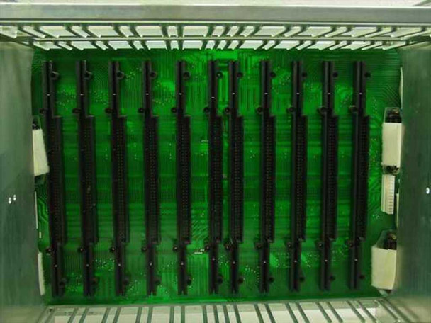 Northern Telecom QSD64A1 interior top-down view showing approximately 10 card slot guides and backplane connector strips on green PCB