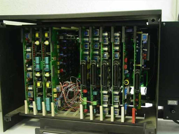 Isoetec EZ-1/96 PBX card cage interior view showing nine populated circuit boards with colorful wiring harnesses, transformers, and edge connectors