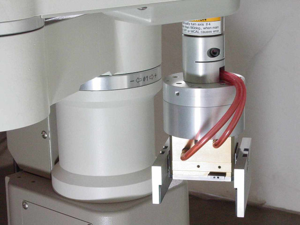 Seiko TT8450 D-Tran SCARA Robot end-of-arm tooling detail showing Robohand RP-15 gripper assembly mounted at wrist with red pneumatic tubing