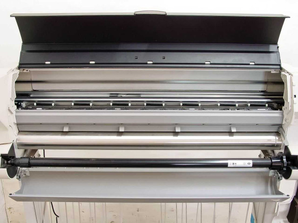 HP DesignJet 2500CP internal print mechanism — platen, guide rails, and media roller visible with top cover open