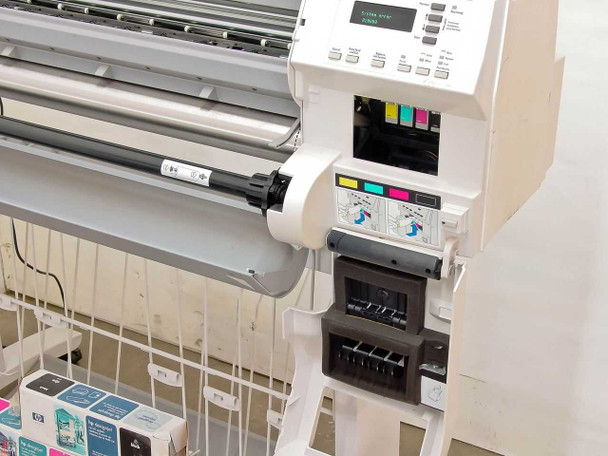 HP DesignJet 2500CP right side — ink system carriage area with CMYK ink connectors and printhead assembly visible