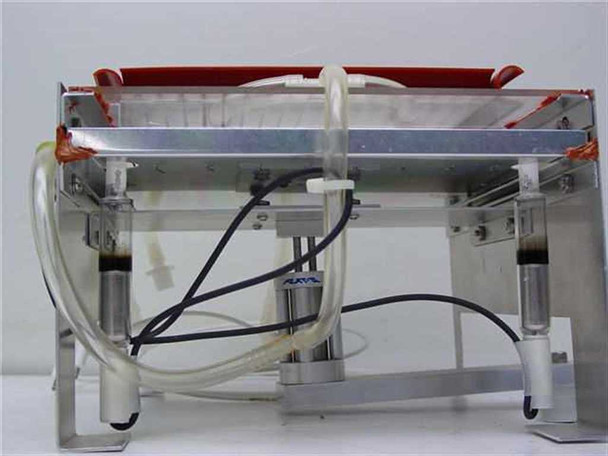 Rear view of UV light frame showing four pneumatic lift cylinders, black electrical wiring, and clear pneumatic/liquid tubing routed along the base