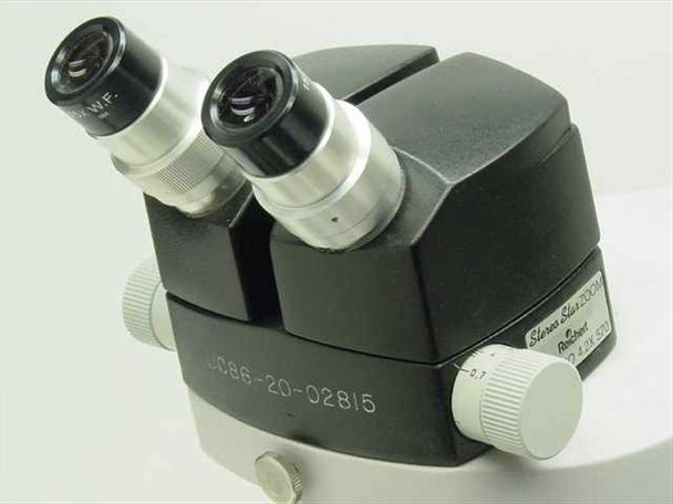 Reichert Stereo Star Zoom Microscope binocular head — 15x W.F. eyepieces, zoom knob, serial number JC86-20-02815 visible on body
