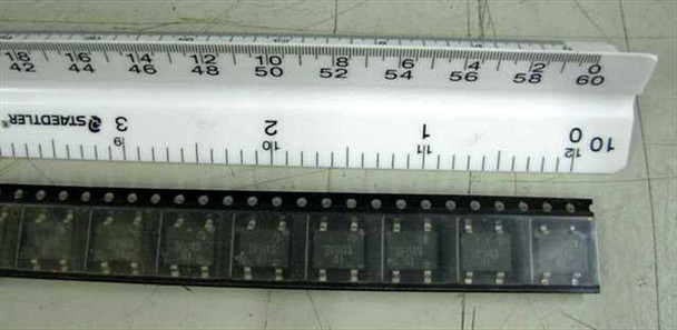 Strip of 20 DF04S SMD bridge rectifier components laid out in a row next to a Staedtler ruler showing full strip length of approximately 60mm
