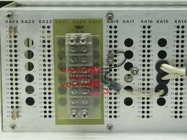 Rear backplane of Quintron modulator chassis showing connector rows XA14 through XA24 with terminal block, DANGER HIGH VOLTAGE warning label, and wiring