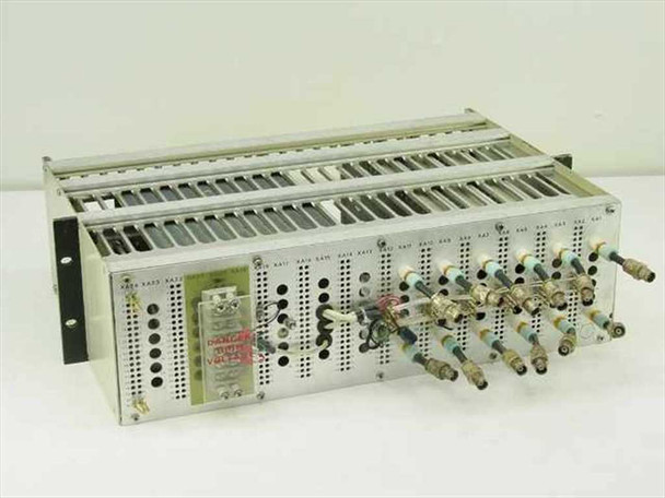 Quintron Systems rackmount FM modulator chassis front-left view showing three modulator cards with BNC and banana jack connectors installed, and DANGER HIGH VOLTAGE label visible on backplane