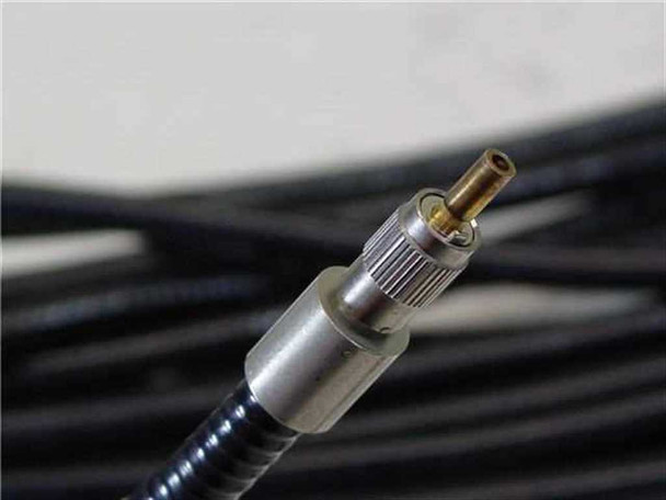 Close-up of STU600F bare ferrule end connector showing metal housing and exposed fiber tip