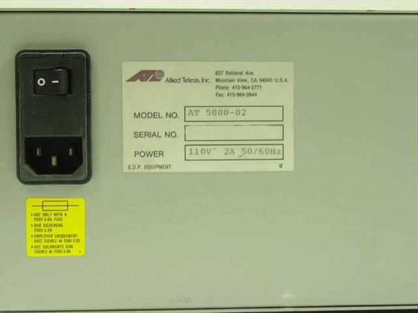 Allied Telesis AT 5000-02 second rating label and IEC power switch on rear panel confirming 110V~ 2A 50/60Hz