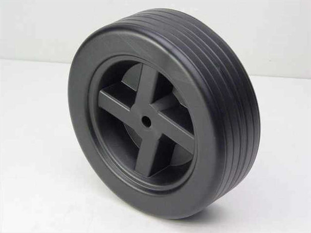 Specialty Mfg. Co. 9-inch plastic replacement wheel – side-angled view showing 6-spoke hub profile and ribbed tread width