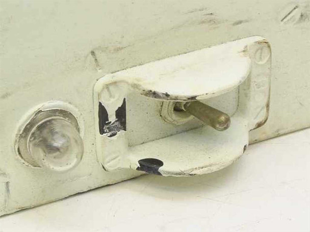 Photo-Sonics power supply latch detail – metal toggle latch on enclosure side with paint chipping visible