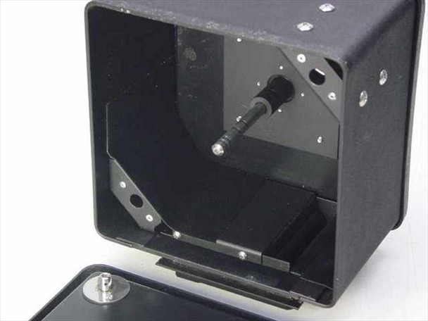 70mm copy camera film magazine – top open showing interior film transport spindle and drive pin mechanism, lid removed