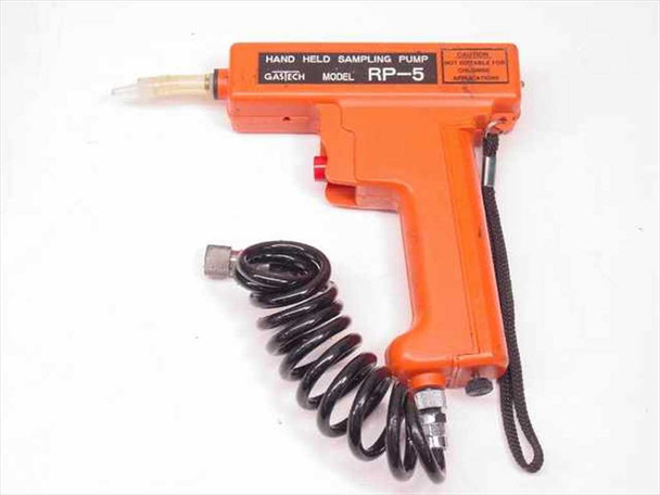Gastech RP-5 hand-held sampling pump orange body with coiled tubing and wrist strap, labeled 'HAND HELD SAMPLING PUMP GASTECH MODEL RP-5'